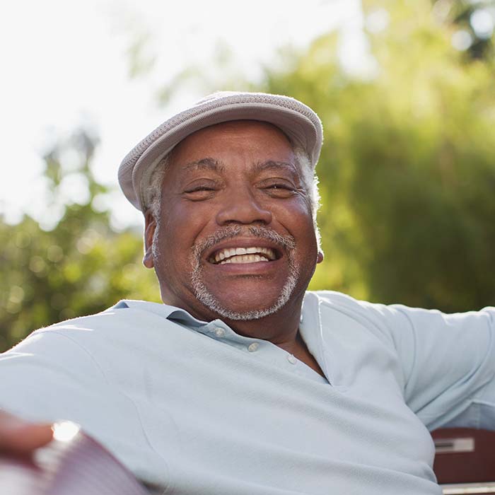 Older man smiling outside of orthodontic office in Fort Wayne, Indiana
